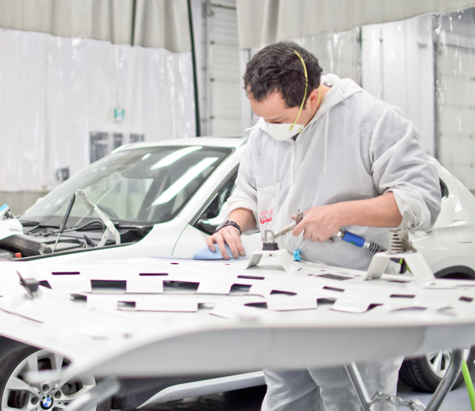 Technician with BMW vechicle Modern auto body Edmonton